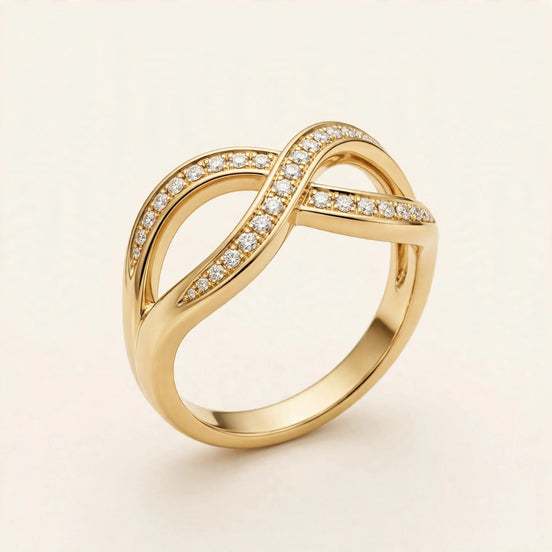 Asymmetric Wave Diamond Band, pavé round diamonds along a sculptural wave band in yellow gold, front view.