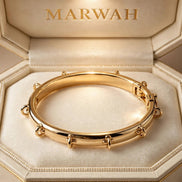 Signature Charm Bangle in the MARWAH ivory box