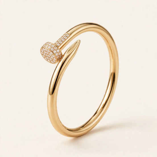 Diamond Nail Cuff, pavé diamond nail head and polished nail wrap in yellow gold, front view.