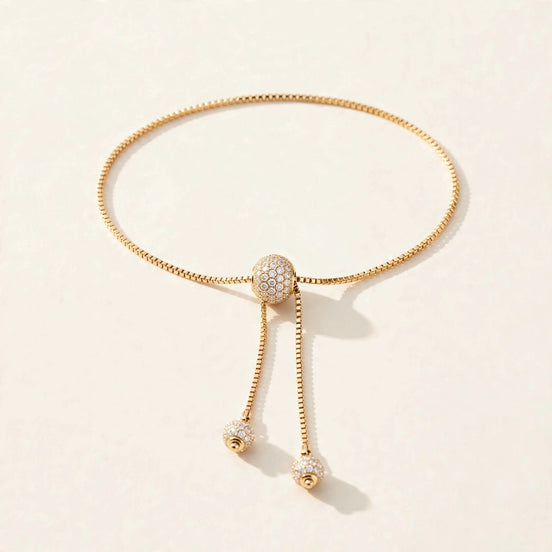 Diamond Slider Bolo Bracelet, pavé diamond slider bead on a fine box chain in yellow gold, front view.