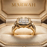 East-West Bezel Emerald Ring