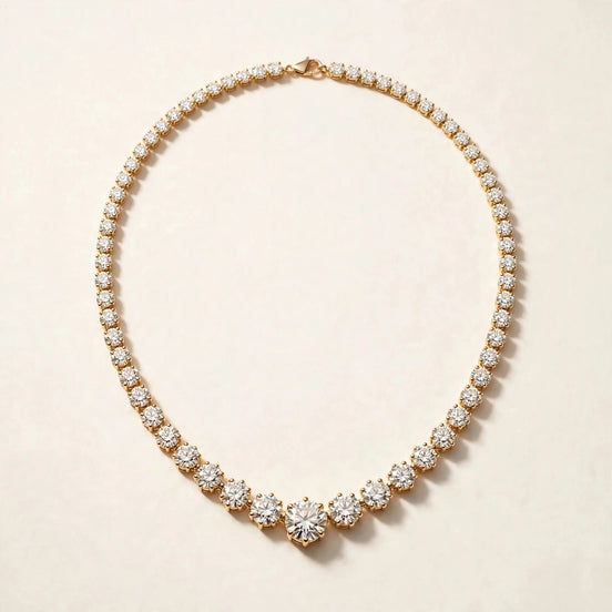 Graduated Diamond Riviera Necklace, round diamonds graduating to a larger center stone in yellow gold, full view.