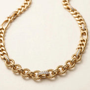 Mixed-Link Diamond Chain, alternating curb, figaro, and round links with pavé accent links in yellow gold, detail view.