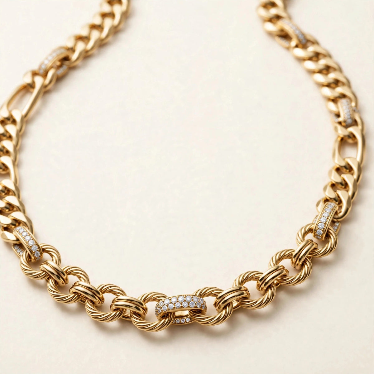 Mixed-Link Diamond Chain, alternating curb, figaro, and round links with pavé accent links in yellow gold, detail view.