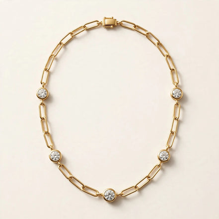 Paperclip Chain with Diamond Stations, elongated paperclip links with five bezel-set round diamonds in yellow gold, full view.