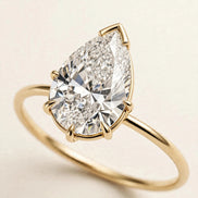 Pear Solitaire Ring, pear-cut lab-grown diamond with a V-prong tip on a fine plain band in yellow gold, three-quarter detail view.