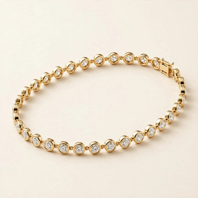 Slim Bezel-Set Diamond Bracelet, round diamonds in slim bezel settings in yellow gold, front view.