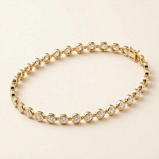 Slim Bezel-Set Diamond Bracelet, round diamonds in slim bezel settings in yellow gold, front view.