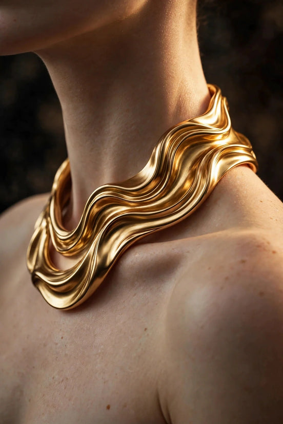 Sculpted gold collar necklace worn on a woman's neck, alternate view — MARWAH
