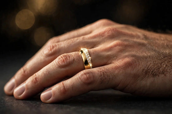Half-pavé comfort-fit diamond band in yellow gold worn on a man's ring finger, alternate view — MARWAH