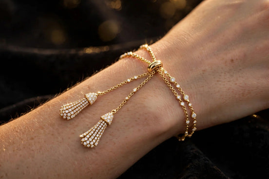 Diamond lariat bracelet in yellow gold worn on a woman's wrist, alternate view — MARWAH