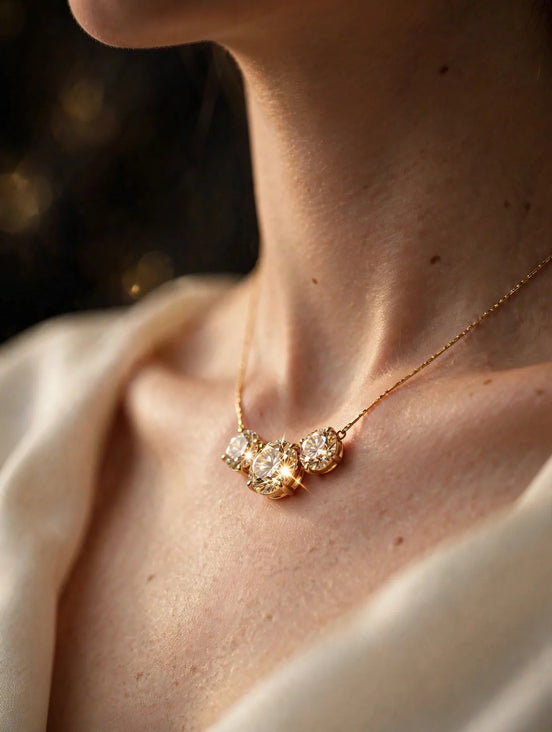 Three-stone diamond pendant in yellow gold worn on a woman's neck, alternate view — MARWAH