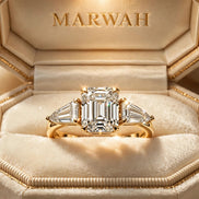 Emerald-Cut Three-Stone Engagement Ring in the MARWAH ivory box