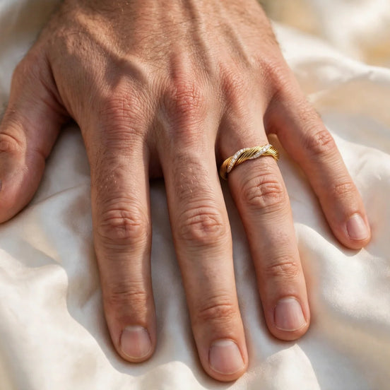Twisted cable diamond wedding band in yellow gold, worn on a man's ring finger — MARWAH